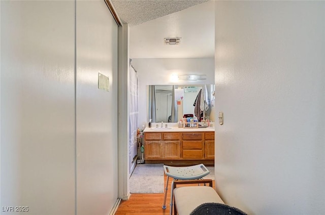 3138 White Rose Way, Henderson, NV 89014 - bathroom with vanity, wood finished floors, and lofted ceiling