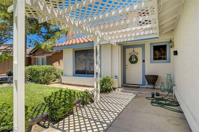 3138 White Rose Way, Henderson, NV 89014 - property entrance with stucco siding, a pergola, a tiled roof, and a patio