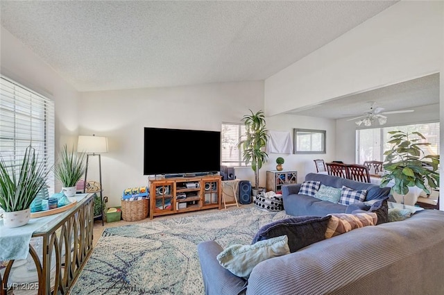 3138 White Rose Way, Henderson, NV 89014 - living area with vaulted ceiling, a textured ceiling, and a ceiling fan