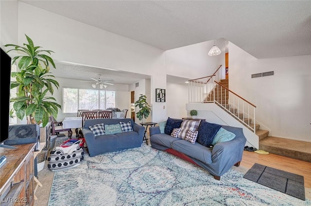 3138 White Rose Way, Henderson, NV 89014 - living area featuring stairway, wood finished floors, a textured ceiling, and ceiling fan
