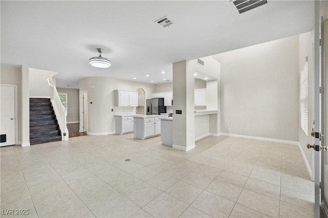 258 Chamomile Dr, Henderson, NV 89015 - unfurnished living room with baseboards, light tile patterned floors, stairway, and recessed lighting