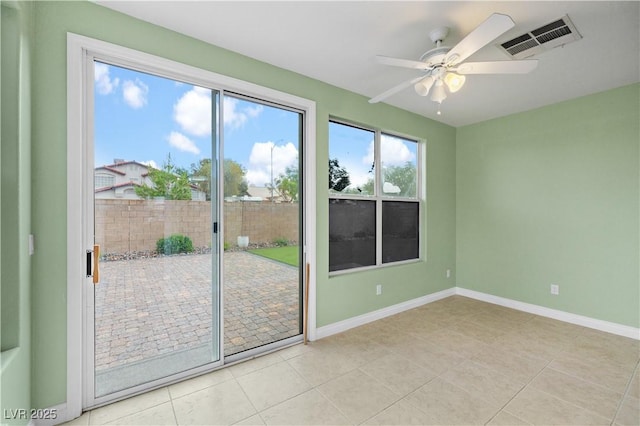 258 Chamomile Dr, Henderson, NV 89015 - doorway with light tile patterned floors, ceiling fan, and baseboards