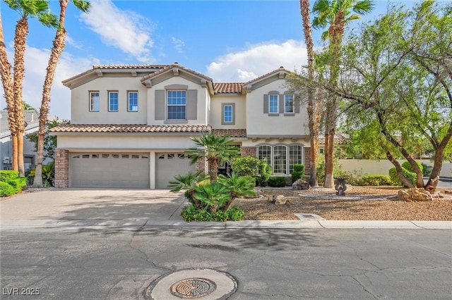 253 White Willow Ave, Las Vegas, NV 89123 - mediterranean / spanish home with a garage, driveway, stucco siding, and a tiled roof