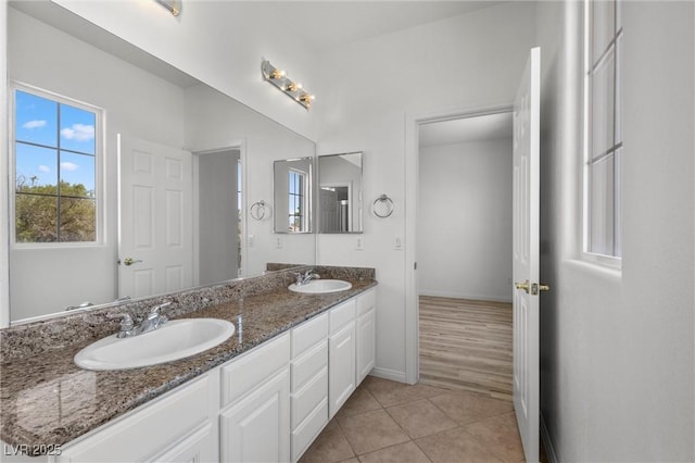 253 White Willow Ave, Las Vegas, NV 89123 - full bathroom with double vanity, baseboards, and tile patterned flooring