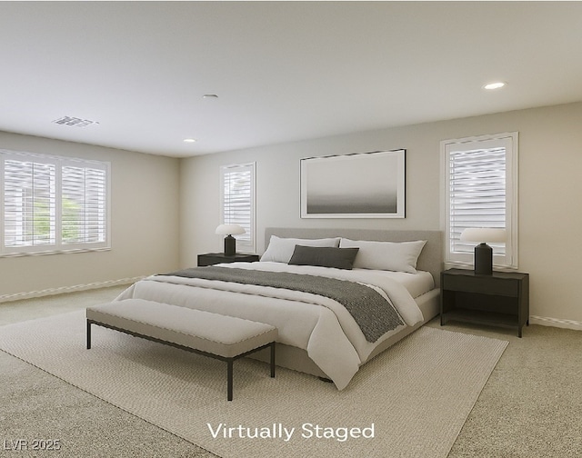 bedroom featuring light colored carpet, recessed lighting, and baseboards
