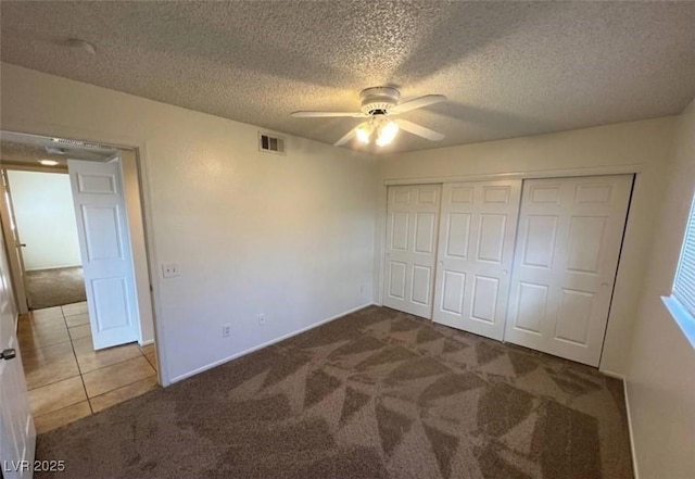 101 Luna Way Unit 145, Las Vegas, NV 89145 - unfurnished bedroom with carpet floors, a textured ceiling, a closet, a ceiling fan, and baseboards