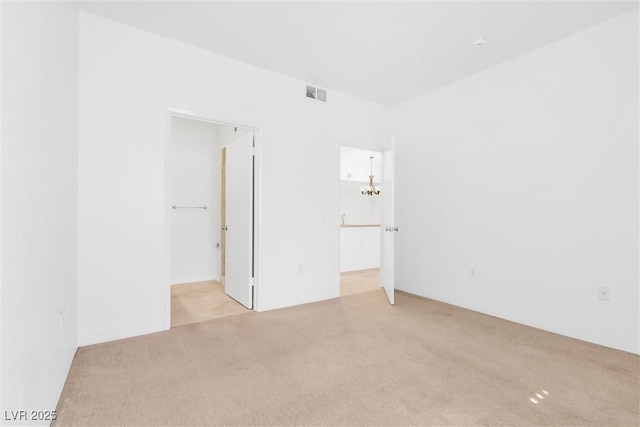 2615 W Gary Ave Unit 1041, Las Vegas, NV 89123 - carpeted empty room with a chandelier