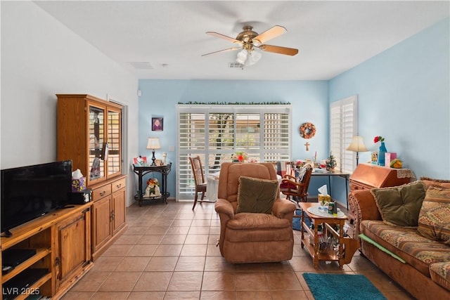 living room with light tile patterned floors and a ceiling fan
