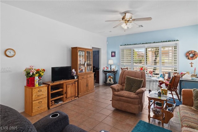tiled living room with ceiling fan