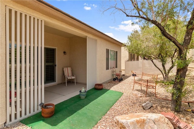 view of yard with fence and a patio