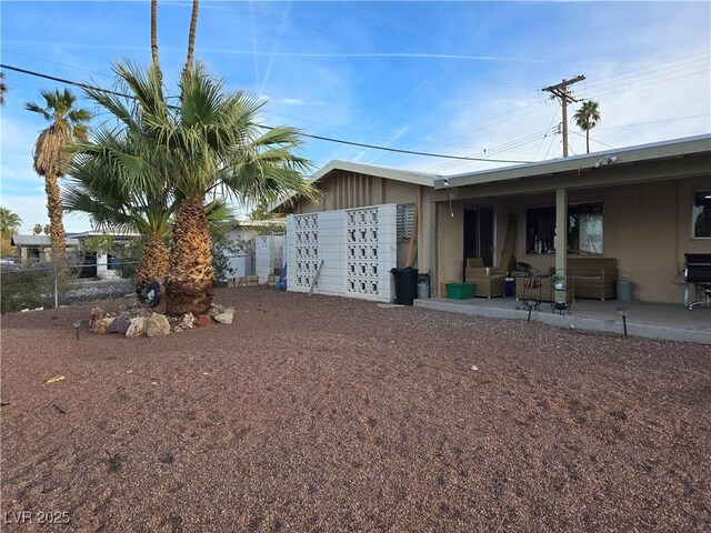 1389 Pawnee Dr, Las Vegas, NV 89169 - rear view of house featuring fence and a patio area