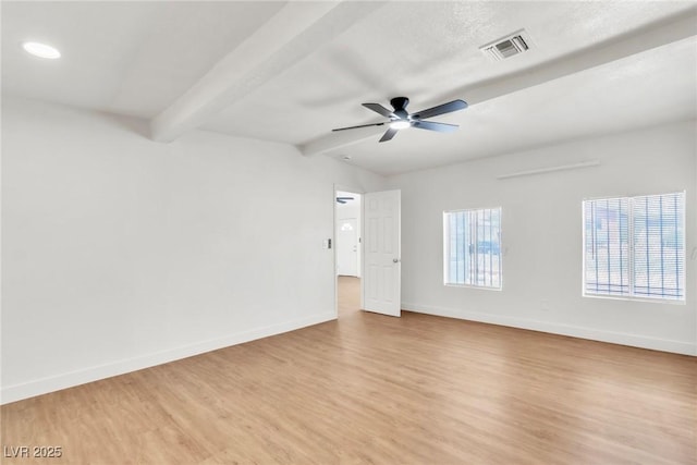 empty room featuring baseboards, light wood finished floors, beam ceiling, and a ceiling fan