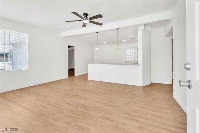 unfurnished living room featuring ceiling fan, light wood-style flooring, baseboards, and recessed lighting