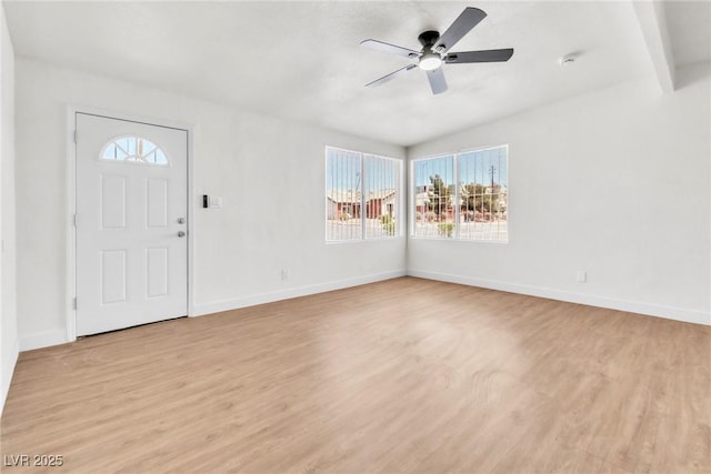 entryway with light wood-style flooring, ceiling fan, and baseboards