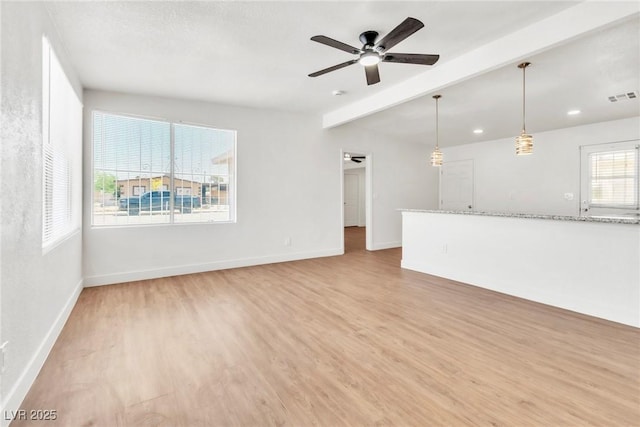 unfurnished living room with light wood-type flooring, a ceiling fan, beamed ceiling, baseboards, and recessed lighting