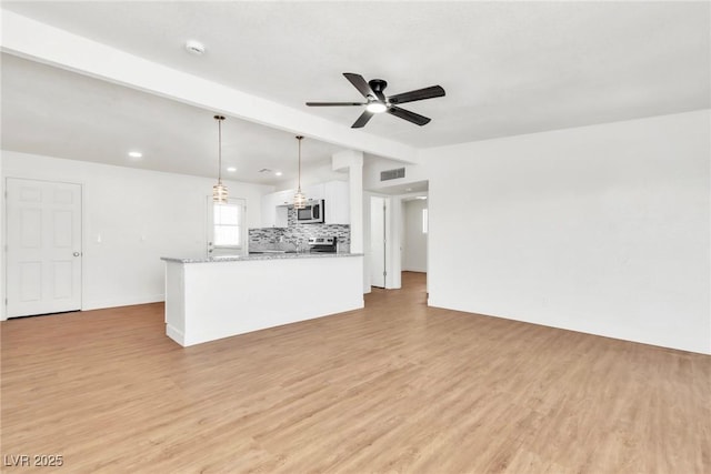 unfurnished living room with a ceiling fan, light wood-style flooring, and recessed lighting