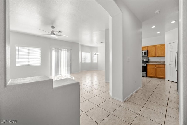 2333 Silver Crew Pass, Henderson, NV 89052 - kitchen featuring appliances with stainless steel finishes, open floor plan, light tile patterned floors, ceiling fan, and recessed lighting