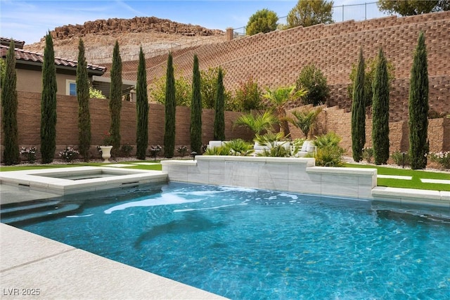 4220 San Alivia Ct, Las Vegas, NV 89141 - view of swimming pool with fence, an in-ground hot tub, and a mountain view