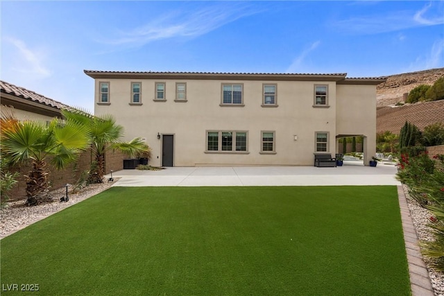 4220 San Alivia Ct, Las Vegas, NV 89141 - rear view of house with a patio area, stucco siding, and a lawn