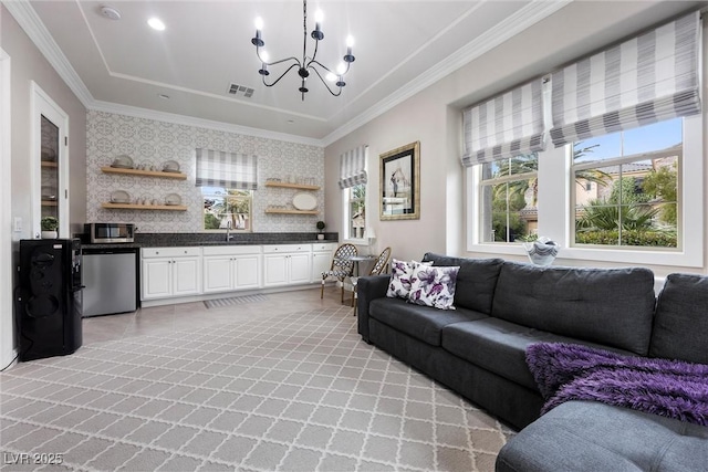 4220 San Alivia Ct, Las Vegas, NV 89141 - living area with a chandelier, plenty of natural light, crown molding, and wallpapered walls