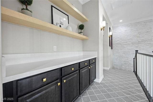 4220 San Alivia Ct, Las Vegas, NV 89141 - bar with light carpet, baseboards, and crown molding