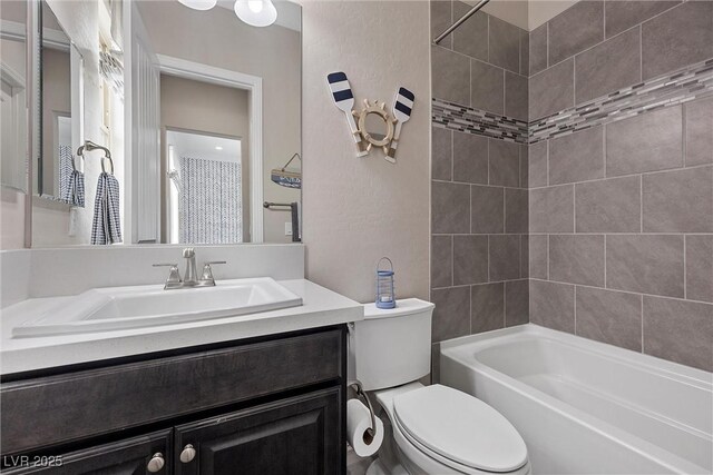 4220 San Alivia Ct, Las Vegas, NV 89141 - full bath with toilet, vanity, washtub / shower combination, and a textured wall