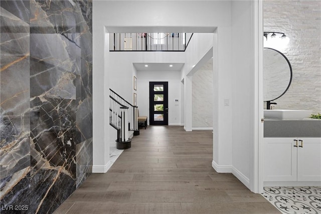 4220 San Alivia Ct, Las Vegas, NV 89141 - entrance foyer featuring stairway, wood finished floors, baseboards, a high ceiling, and recessed lighting