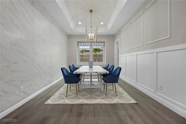 4220 San Alivia Ct, Las Vegas, NV 89141 - dining space featuring a chandelier, dark wood finished floors, ornamental molding, a decorative wall, and recessed lighting