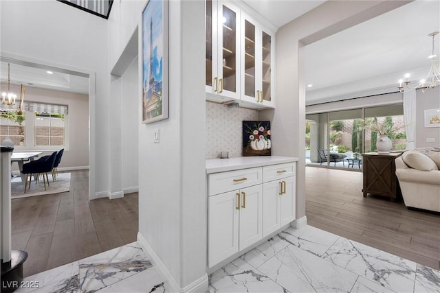 4220 San Alivia Ct, Las Vegas, NV 89141 - bar with a chandelier, plenty of natural light, baseboards, and recessed lighting