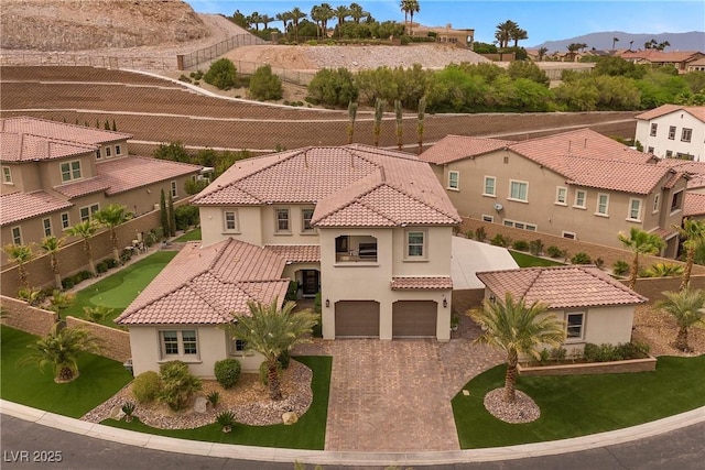 4220 San Alivia Ct, Las Vegas, NV 89141 - mediterranean / spanish home with stucco siding, a tile roof, an attached garage, a residential view, and driveway