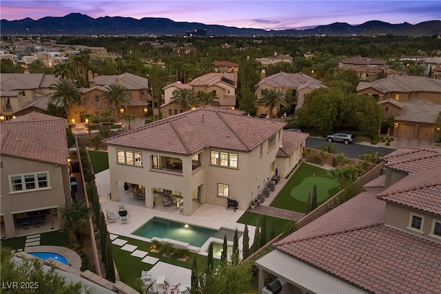 4220 San Alivia Ct, Las Vegas, NV 89141 - aerial view at dusk of a mountain view, a residential view, and view of pool