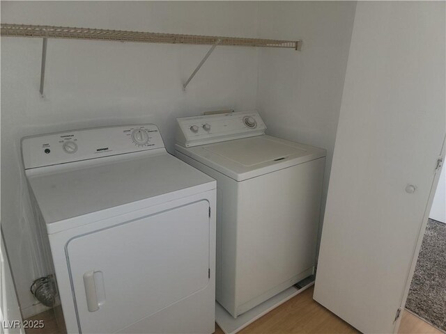3965 Rebecca Raiter Ave Unit 201, Las Vegas, NV 89110 - laundry area featuring washing machine and clothes dryer and light wood-style floors