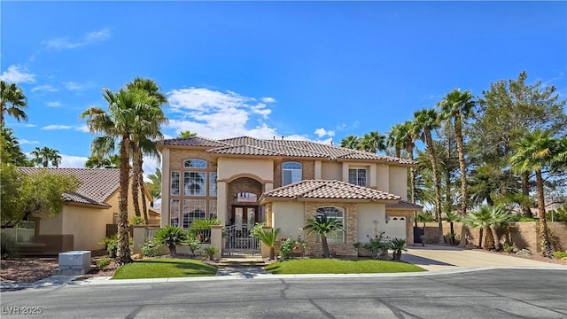 5445 Pendini Point Ct, Las Vegas, NV 89141 - mediterranean / spanish-style house with driveway, stucco siding, a gate, and a tile roof