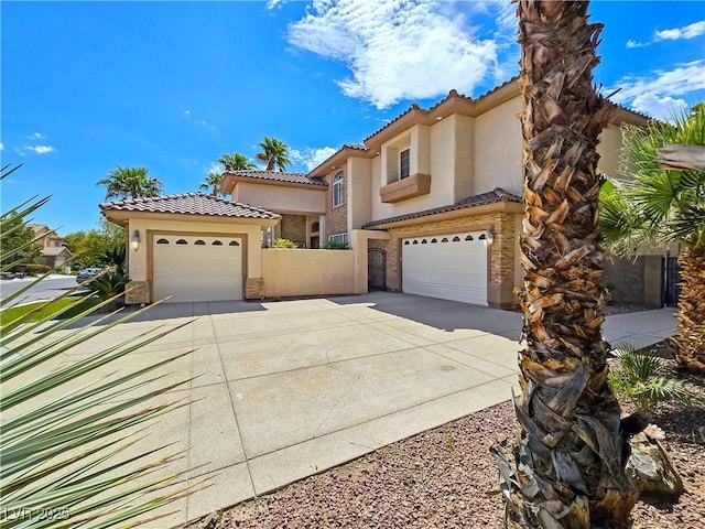 5445 Pendini Point Ct, Las Vegas, NV 89141 - mediterranean / spanish-style home with stucco siding, a tile roof, concrete driveway, and an attached garage