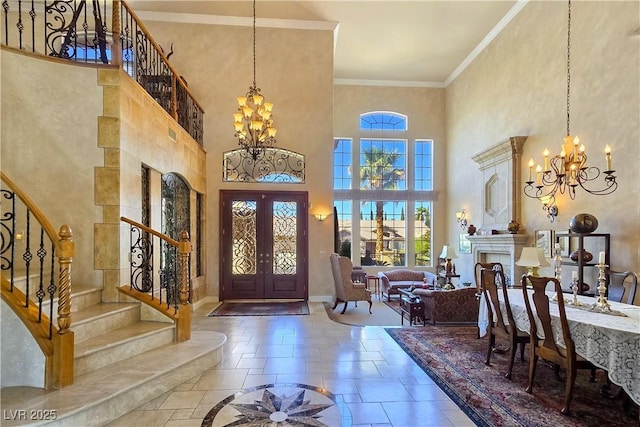 5445 Pendini Point Ct, Las Vegas, NV 89141 - entrance foyer featuring a chandelier, stairs, french doors, a high ceiling, and baseboards
