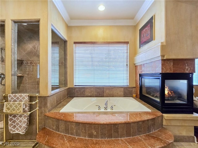 5445 Pendini Point Ct, Las Vegas, NV 89141 - bathroom with ornamental molding, a bath, a tile fireplace, and a tile shower