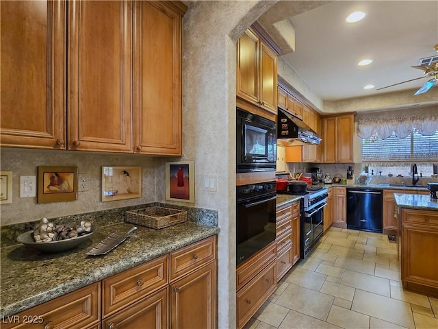 5445 Pendini Point Ct, Las Vegas, NV 89141 - kitchen with black appliances, a sink, under cabinet range hood, brown cabinets, and dark stone counters