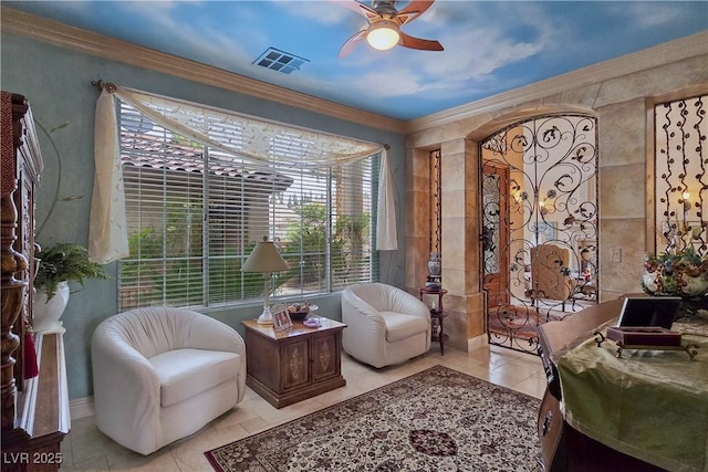 5445 Pendini Point Ct, Las Vegas, NV 89141 - sitting room with crown molding, light tile patterned floors, ceiling fan, and baseboards