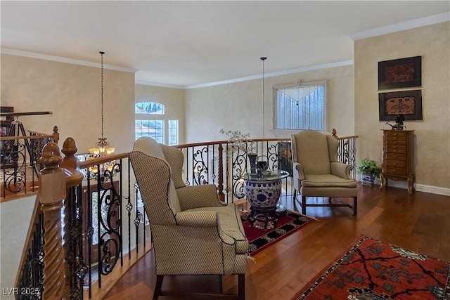 5445 Pendini Point Ct, Las Vegas, NV 89141 - sitting room featuring a chandelier, wood finished floors, an upstairs landing, ornamental molding, and baseboards