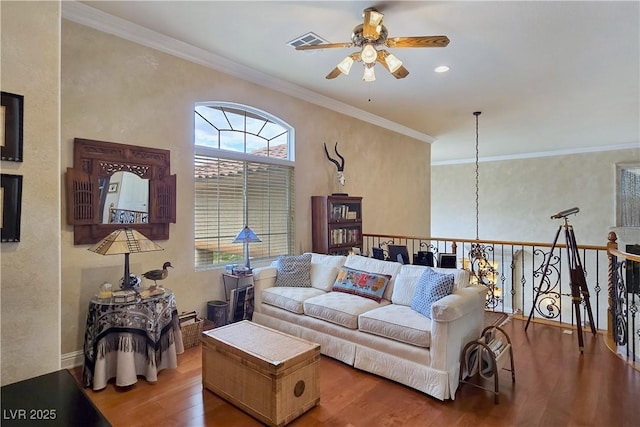 5445 Pendini Point Ct, Las Vegas, NV 89141 - living area featuring ceiling fan, healthy amount of natural light, wood finished floors, and crown molding
