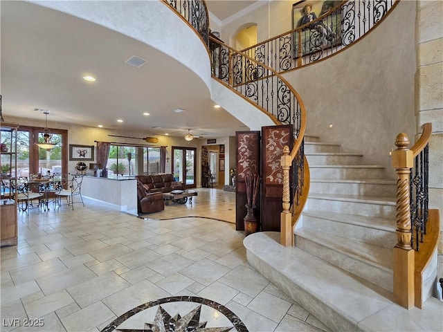5445 Pendini Point Ct, Las Vegas, NV 89141 - foyer featuring stairway, baseboards, recessed lighting, a high ceiling, and a ceiling fan