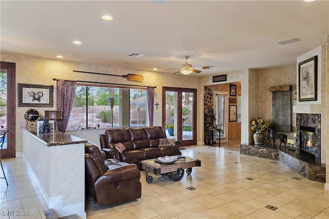 5445 Pendini Point Ct, Las Vegas, NV 89141 - living area with ceiling fan, plenty of natural light, a fireplace, recessed lighting, and baseboards