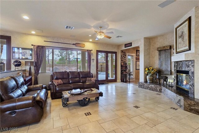 5445 Pendini Point Ct, Las Vegas, NV 89141 - living room with a ceiling fan, a high end fireplace, and recessed lighting