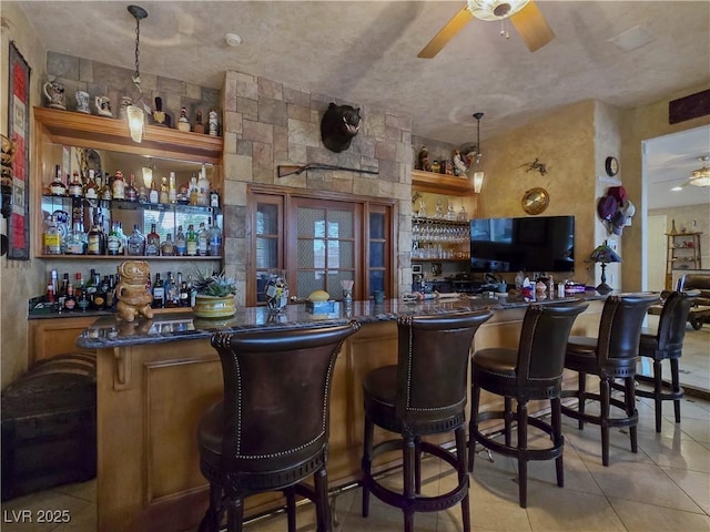 5445 Pendini Point Ct, Las Vegas, NV 89141 - indoor bar with a ceiling fan, light tile patterned flooring, and decorative light fixtures