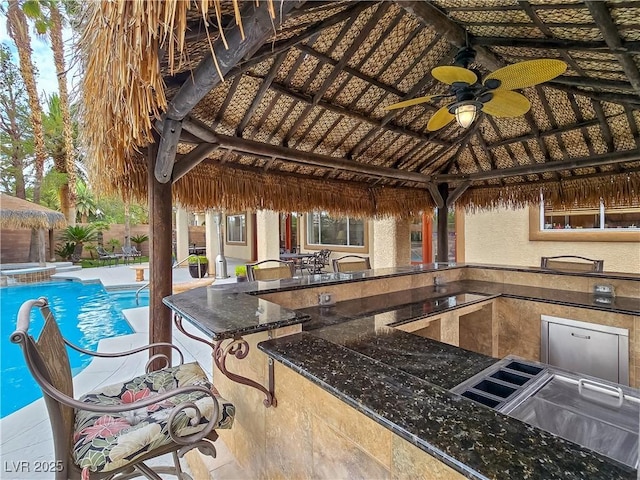 5445 Pendini Point Ct, Las Vegas, NV 89141 - view of patio featuring a gazebo, exterior kitchen, ceiling fan, and an outdoor pool
