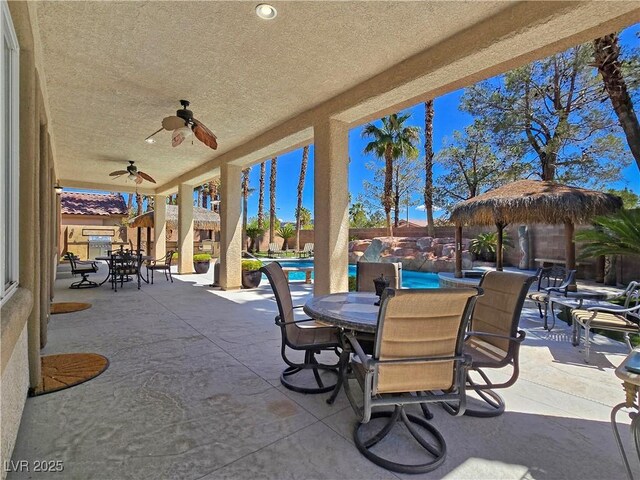 5445 Pendini Point Ct, Las Vegas, NV 89141 - view of patio / terrace with outdoor dining space, a ceiling fan, and a fenced backyard
