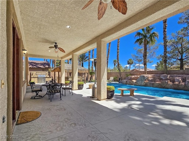 5445 Pendini Point Ct, Las Vegas, NV 89141 - view of patio featuring a ceiling fan, outdoor dining space, and a fenced backyard