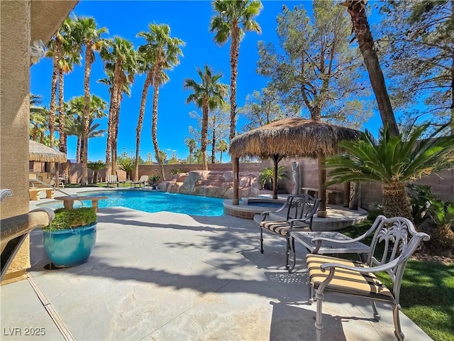 5445 Pendini Point Ct, Las Vegas, NV 89141 - view of swimming pool with a patio, a fenced backyard, and a pool with connected hot tub