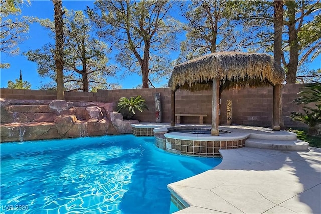 5445 Pendini Point Ct, Las Vegas, NV 89141 - view of swimming pool featuring a fenced backyard, a pool with connected hot tub, and a patio area