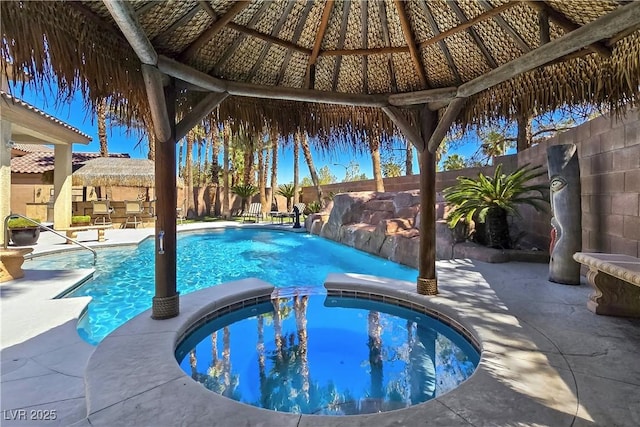 5445 Pendini Point Ct, Las Vegas, NV 89141 - view of pool with a gazebo, a pool with connected hot tub, a fenced backyard, and a patio